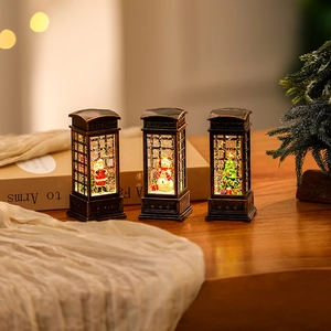 Three bronze Christmas lanterns with Santa, snowman and tree inside for festive decor