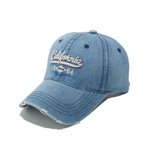 Close-up of vintage light blue denim baseball cap with California 3D embroidery detail