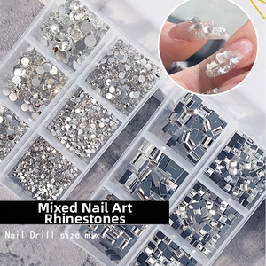 Flatback nail rhinestones in a 12-compartment box with various sizes for nail art decoration
