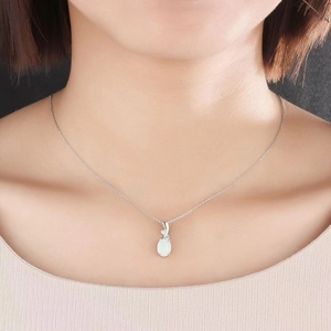 Elegant silver chain necklace with a polished white oval opal pendant for women