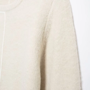 Minimalist cream knit sweater with crew neck and textured wool blend fabric design