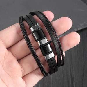 Classic multilayer black leather bracelet with silver metal and stone on hand
