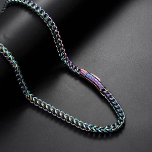 Macro detail of rainbow gradient metallic chain necklace with high gloss finish