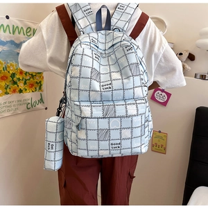 Light blue plaid backpack with cartoon rabbit print and matching small pencil pouch