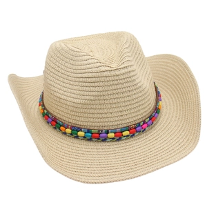 Detail of multi-colored ethnic beads on a straw cowboy hat for summer sun protection