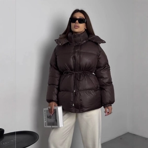 Women's dark brown puffer coat with drawstring waist and quilted hooded design