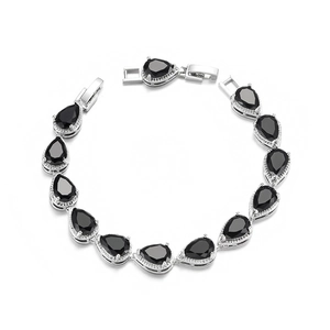 Macro view of silver bracelet featuring teardrop black cubic zirconia and folding clasp