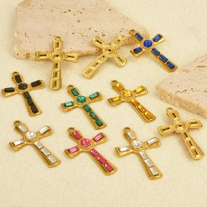 Detailed view of ten gold stainless steel cross pendants with vibrant rectangle gemstones