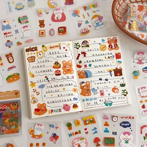 Detail of cute cartoon bear stickers and colorful scrapbooking patterns for journaling