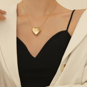 Elegant gold heart pendant necklace for women with minimalist polished metal finish