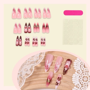 3D floral press-on nails in pink and deep red gradient with gold star accents