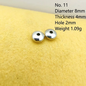 Macro view of 8mm silver spacer beads with 4mm thickness for DIY bracelet crafting