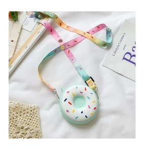 Detail of mint green silicone donut purse with rainbow strap and embossed Hello text