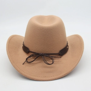 Detail view of khaki western cowboy hat with cattle head decor and felt texture