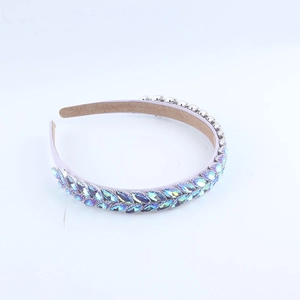 Detail of lavender headband featuring two rows of glittering blue-purple crystal rhinestones