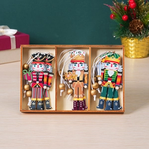 Three-piece painted wooden nutcracker soldier ornament set with hanging ropes and gift box
