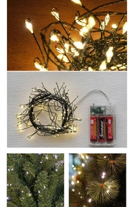 Close-up of LED fairy lights with transparent AA battery box for Christmas tree decoration