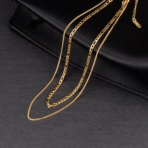 Double-layered 18K gold plated multi-strand necklace featuring a Figaro chain design