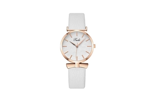 Detail of rose gold watch case with white leaf texture dial and bow-shaped lugs