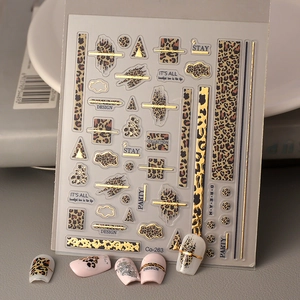 Detail of 5D leopard print nail stickers with gold foil and stylish nail tips display