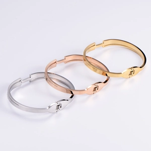 Elegant Roman numeral bangles in gold, silver and rose gold with a hinged clasp design