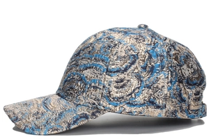 Side view of baseball cap featuring metallic gold and blue jacquard wavy patterns