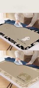 Close-up of heat-resistant ironing mats with floral and heart puppy patterns on desk