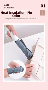 Gray heat resistant silicone mat for hair tools being placed into a travel bag