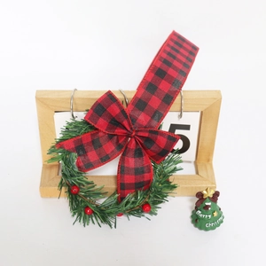 Christmas cabinet wreath with red berry bow, wooden calendar and mini tree decor set