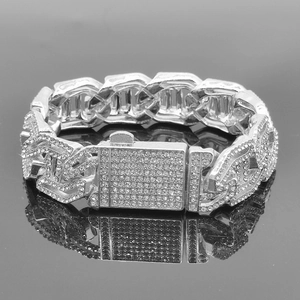 Close-up of silver metal hip hop bracelet with iced-out rhinestone rectangular buckle