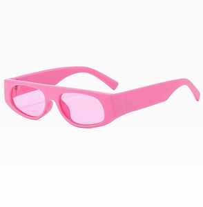 Close-up of pink retro Y2K sunglasses with thick frames and flat oval lenses