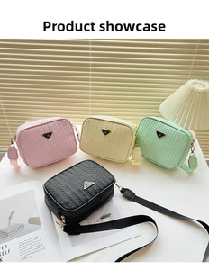 Detail of woven texture crossbody bag showing square shape and metal triangle plaque