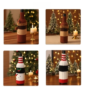Detail of knitted Christmas wine bottle covers with reindeer and snowman designs