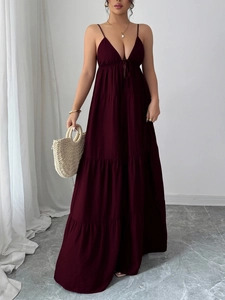 Detail of burgundy deep V-neck tiered maxi dress featuring elegant flowing ruffles