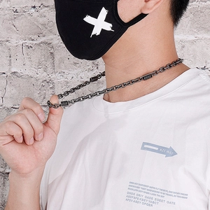 Men's vintage black stainless steel biker chain necklace with spring accents on a model