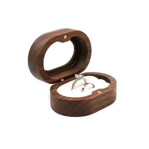 Oval walnut wood jewelry box for rings with white velvet lining and magnetic closure