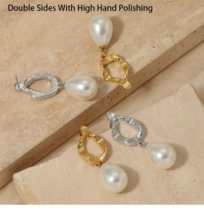 Detail of high hand polished stainless steel hoop earrings with pearl waterdrop pendants