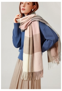 Detailed view of British style plaid scarf fringe with pink and mocha cashmere texture