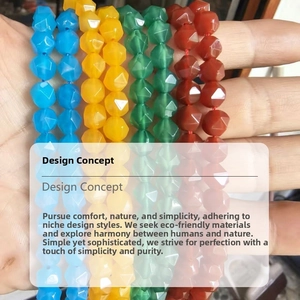 Macro detail of multi-faceted natural stone beads in blue, yellow, green, and red hues