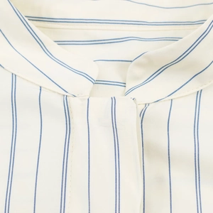 Close-up of a striped stand collar shirt with blue stripes and fine fabric texture