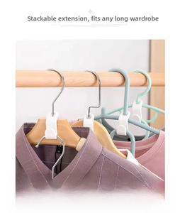 Space-saving white plastic hanger connector hooks showing vertical storage on various hangers