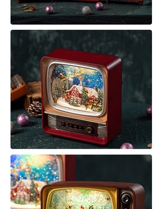 Close-up of vintage red TV Christmas music box with a snowy scene and manual knobs
