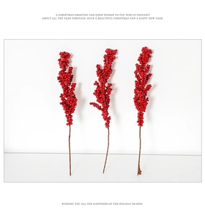 Close-up of artificial red berry stems for Christmas tree decoration and floral arrangements