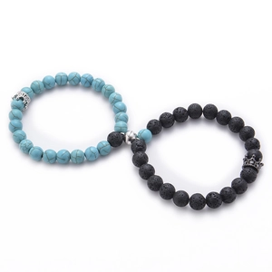 Close-up of magnetic heart clasp on turquoise and lava stone crown couple bracelets