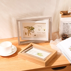 Nordic rotating wooden double-sided 5x7 photo frame displayed in a cozy home setting