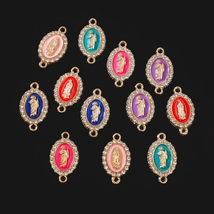 Oval religious Virgin Mary enamel pendants with rhinestones in multiple colors on black background
