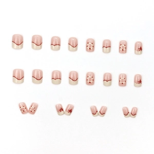 French cream puff style press-on nails with pink base and red wavy patterns, 24 piece set