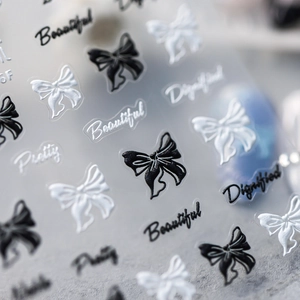 5D nagelstickers met zwart-witte strikjes en 3D-reliëfpatronen op transparant vel