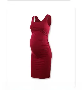 Detail of burgundy sleeveless maternity dress with side ruching for belly comfort