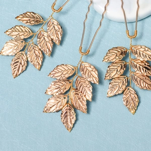 Three gold leaf hair pins set for bridal styling and elegant wedding hair accessories